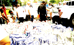 Hundreds of vulnerable Rivers residents defy rain for free food 