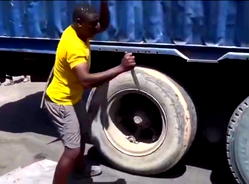 Video: Man escapes death after attempts to burst truck tyre