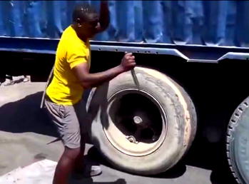 Video: Man escapes death after attempts to burst truck tyre