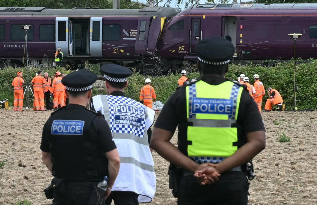 One dead and 28 injured in train crash in the UK
