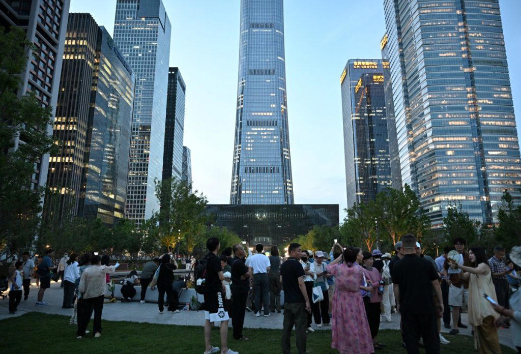 Pilot dies and 13 are hurt in small plane crash into Beijing high-rise