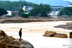China storms leave 17 dead as rescuers search for survivors