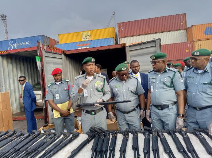 Customs intercepts pump-action rifles at Tin Can Port, suspect on the run