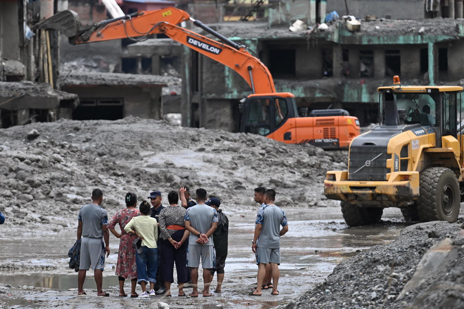 Rescuers claw through mud as Nepal, China flood missing toll nears 3,000