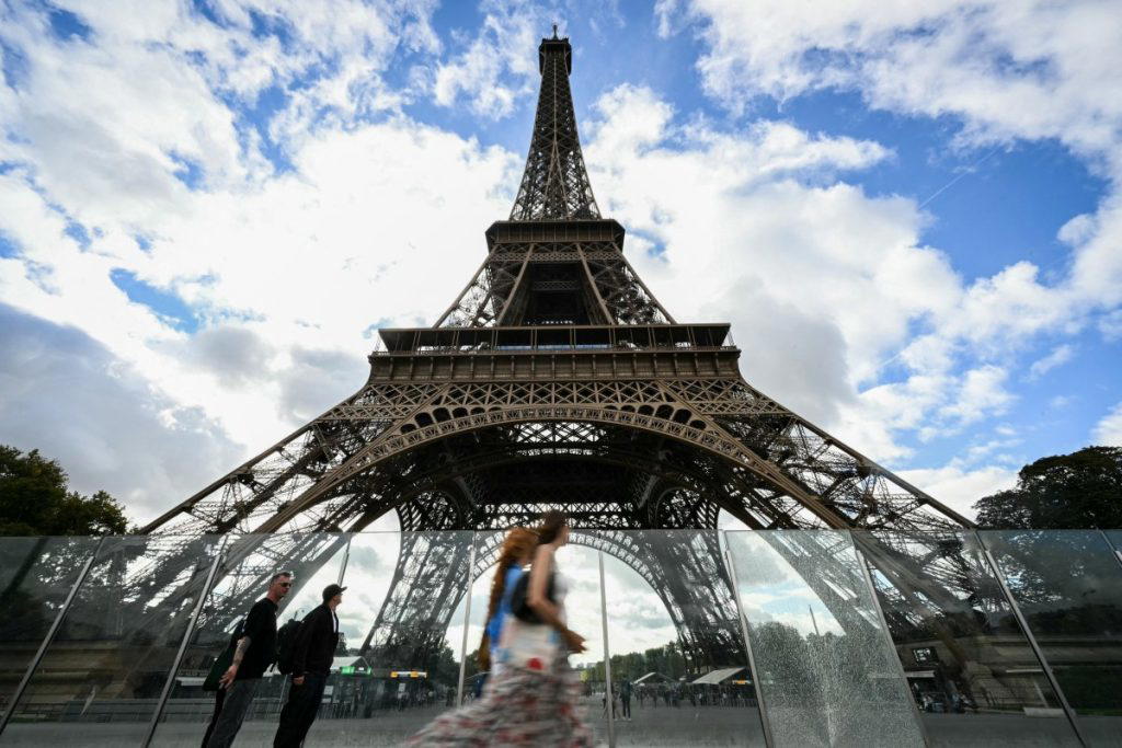 Eiffel Tower reopens after row over removing women staff