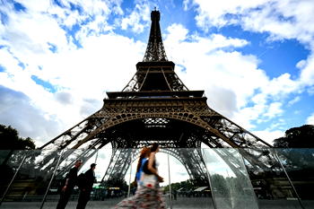 Eiffel Tower reopens after row over removing women staff