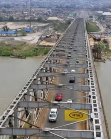 Umahi orders Tinubu pictures on First Niger Bridge