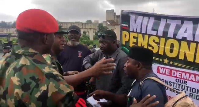 Protesting military veterans demand fair pension adjustment, block board entrance